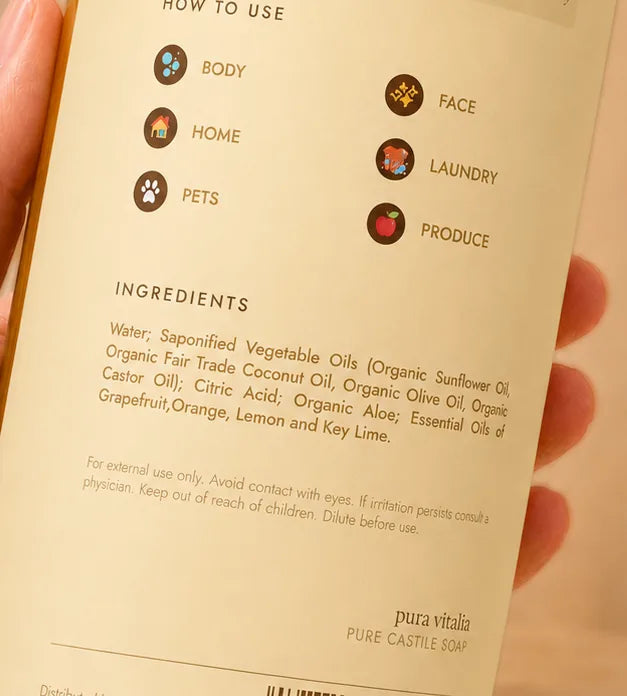 Close-up of the Pura Vitalia ingredient label held in a hand