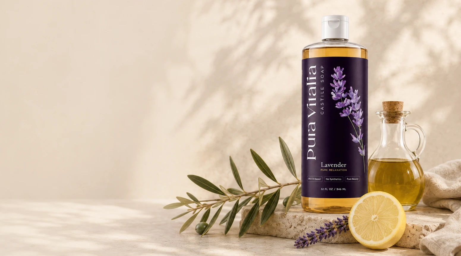 Pura Vitalia Lavender castile soap with olive branch, olive oil and lemon on a sunlit Mediterranean counter