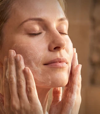 A woman washing her face with castile soap